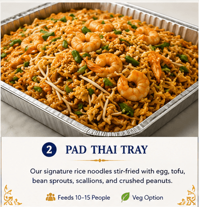 Aluminum tray filled with Pad Thai noodles, large shrimp, bean sprouts, and green scallions.