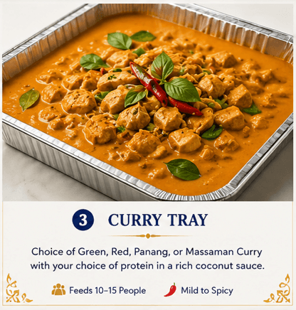Aluminum tray of orange Thai curry with protein, garnished with fresh basil and red chilies.