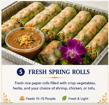 Fresh shrimp spring rolls in a catering tray with peanut dipping sauce and purple orchid.